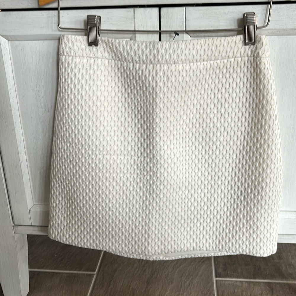 Woman’s Ivory short skirt from Express.  zippered in back.